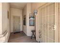 Cozy front porch with security doors, providing additional safety and curb appeal to the home at 16240 W Maricopa St, Goodyear, AZ 85338