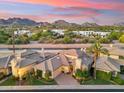 Stunning aerial shot of a luxury home with mountain views and lush landscaping at 3108 E San Juan Ave, Phoenix, AZ 85016