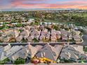Expansive aerial view of a residential neighborhood featuring beautiful homes, a golf course, and a lake at 3108 E San Juan Ave, Phoenix, AZ 85016