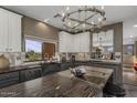 Modern kitchen with sleek countertops, stainless steel appliances, and a view to the outside at 7199 E Ridgeview Pl # 221, Carefree, AZ 85377