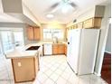 Spacious kitchen with ample countertop space, white appliances, and bright natural lighting at 814 S 80Th St, Mesa, AZ 85208