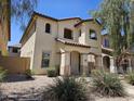 Welcoming two-story home boasts desert landscaping and a charming facade, creating an inviting curb appeal for potential buyers at 9137 W Coolbrook Ave, Peoria, AZ 85382