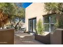 Exterior of the house features a desert landscape with a covered patio at 9154 E Sunflower Ct, Scottsdale, AZ 85266