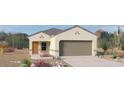 Charming single-story home with desert landscaping, a two-car garage, and a welcoming front entry at 1408 W Hess Ave, Coolidge, AZ 85128