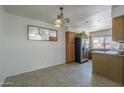 Dining room features tile flooring and ample natural light overlooking modern kitchen appliances at 154 W 5Th St # 212, Tempe, AZ 85281