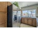 Modern kitchen features stainless steel refrigerator, ample cabinetry, and bright natural light at 154 W 5Th St # 212, Tempe, AZ 85281