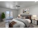 A contemporary main bedroom features a king bed, balcony, and modern decor at 154 W 5Th St # 212, Tempe, AZ 85281