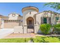 Inviting stucco home showcasing a circular tower entrance and gated courtyard at 20084 E Rosa Rd, Queen Creek, AZ 85142