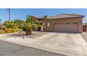 Beautiful single-story home with desert landscaping, driveway and a welcoming facade at 269 W Seaside Dr, Casa Grande, AZ 85122