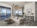 Bright and airy living room featuring an open floor plan and a seamless transition to the outdoors at 28437 N 112Th Way, Scottsdale, AZ 85262