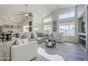 Inviting open-concept living room with bright decor, modern furniture, with views of pool at 2930 N 154Th Dr, Goodyear, AZ 85395