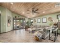 Inviting living area featuring wood-style flooring, neutral paint, and ample natural light at 4377 S Soboba St, Gilbert, AZ 85297