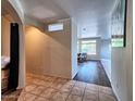 Inviting entryway featuring tile flooring and archways leading to the living spaces at 44182 W Juniper Ave, Maricopa, AZ 85138