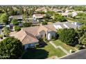 An aerial view of the home showcases the well-manicured front lawn and architectural details of the house at 541 E Spur Ave, Gilbert, AZ 85296