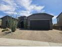 View of the house and the brick paved driveway at 5637 E Lonesome Trl, Cave Creek, AZ 85331