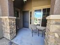 Inviting covered porch with stone accents and outdoor seating at 5637 E Lonesome Trl, Cave Creek, AZ 85331