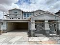 New construction home showcasing a modern exterior design and a spacious three-car garage at 7410 W Buckhorn Trl, Peoria, AZ 85383