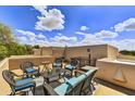 Desert home patio with comfortable seating area and beautiful blue sky at 9780 E Gamble Ln, Scottsdale, AZ 85262