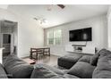 Spacious living room features comfortable seating, a TV, and a dining table with natural light at 1322 S Owl Dr, Gilbert, AZ 85296