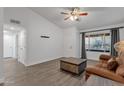 Bright living room with vaulted ceilings, wood-look floors, and a large window at 13636 N Hamilton Dr # 101, Fountain Hills, AZ 85268