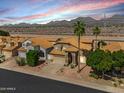 Lovely home with a tile roof in a landscaped community with mountain views and desert surroundings at 14393 N 101St St, Scottsdale, AZ 85260