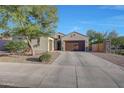 Home with desert landscaping and a three-car garage at 16229 W Berkeley Rd, Goodyear, AZ 85395