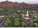 Expansive aerial view showcasing the luxurious community, desert landscape, and mountain backdrop at 19922 N 101St Pl, Scottsdale, AZ 85255