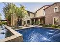 Stunning backyard featuring a refreshing pool, spa, and outdoor dining area at 19922 N 101St Pl, Scottsdale, AZ 85255