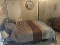 Modest bedroom featuring a tile floor, double bed, and minimal furnishings at 277 W 16Th Ave, Apache Junction, AZ 85120