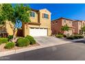 Inviting two-story home with a two car garage, manicured landscaping, and warm curb appeal at 3231 S Mingus Dr, Chandler, AZ 85286