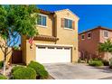 Inviting two-story home with a two car garage, manicured landscaping, and warm curb appeal at 3231 S Mingus Dr, Chandler, AZ 85286