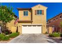 Inviting two-story home with a two car garage, manicured landscaping, and warm curb appeal at 3231 S Mingus Dr, Chandler, AZ 85286