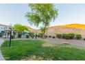 Inviting community area featuring a swimming pool, landscaping, and walking paths at 3236 E Chandler Blvd # 3031, Phoenix, AZ 85048
