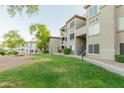 Condominium buildings surrounded by lush greenery and well-manicured lawns at 3236 E Chandler Blvd # 3031, Phoenix, AZ 85048