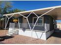 Charming single-Gathering home with covered front porch and a cheerful flower pot at 549 E Mckellips Rd # 18, Mesa, AZ 85203