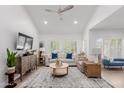 Comfortable living room with vaulted ceilings, white walls, hardwood floors, and a ceiling fan at 6350 N 78Th St # 280, Scottsdale, AZ 85250
