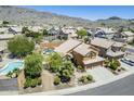 Expansive desert property showcasing lush landscaping, private backyard pool, and mountain views at 768 E Mountain Sky Ave, Phoenix, AZ 85048