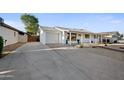 Single story home, with a garage, large driveway, and covered front patio at 8524 E Mariposa Dr, Scottsdale, AZ 85251