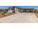Inviting single-story home with extended driveway and covered carport area for outdoor seating at 8840 E Sunland Ave # 137, Mesa, AZ 85208