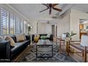 Bright living room features hardwood floors, modern furnishings, and a calming color palette at 12210 N 67Th St, Scottsdale, AZ 85254