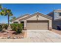 Attractive single-story home with a well-maintained front yard and neutral color palette at 12438 W Flores Dr, El Mirage, AZ 85335
