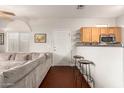 Comfortable living space with a plush sofa and bar stool seating at 1350 S Greenfield Rd # 1040, Mesa, AZ 85206