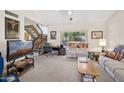 Bright living room with staircase access and view to the outside at 16276 E Rosetta Dr # 58, Fountain Hills, AZ 85268