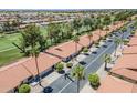 Scenic aerial view of a well-maintained community with lush landscaping and tile roofs at 2311 S Farnsworth Dr # 81, Mesa, AZ 85209