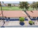 Aerial view of a single-story home featuring a desert landscape, front patio, and a well-maintained exterior at 2311 S Farnsworth Dr # 81, Mesa, AZ 85209