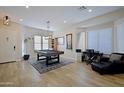 Spacious game room with pool table, stylish lighting, and plenty of natural light at 26624 N 41St St, Cave Creek, AZ 85331