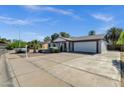 Inviting single-Gathering home boasts a spacious driveway and xeriscape landscaping at 3711 S Judd St, Tempe, AZ 85282