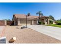 Traditional style home with a three-car garage, desert landscaping, and basketball hoop at 3784 E Simpson Ct, Gilbert, AZ 85297