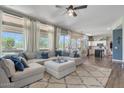 Bright and airy living room featuring large windows, hardwood floors, and a comfortable sectional sofa at 3812 N Barron --, Mesa, AZ 85207