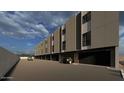 Modern townhome exterior featuring private garages, with plenty of parking, and desert-friendly landscaping at 4220 N 32Nd St # 2, Phoenix, AZ 85018
